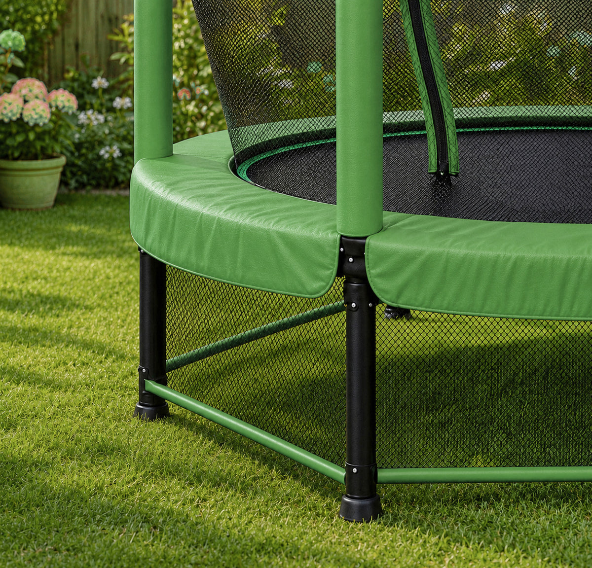 Green backyard trampoline for kids with rust resistant galvanised steel frame, padded safety poles, and dual zip entrance with upper and lower netting.