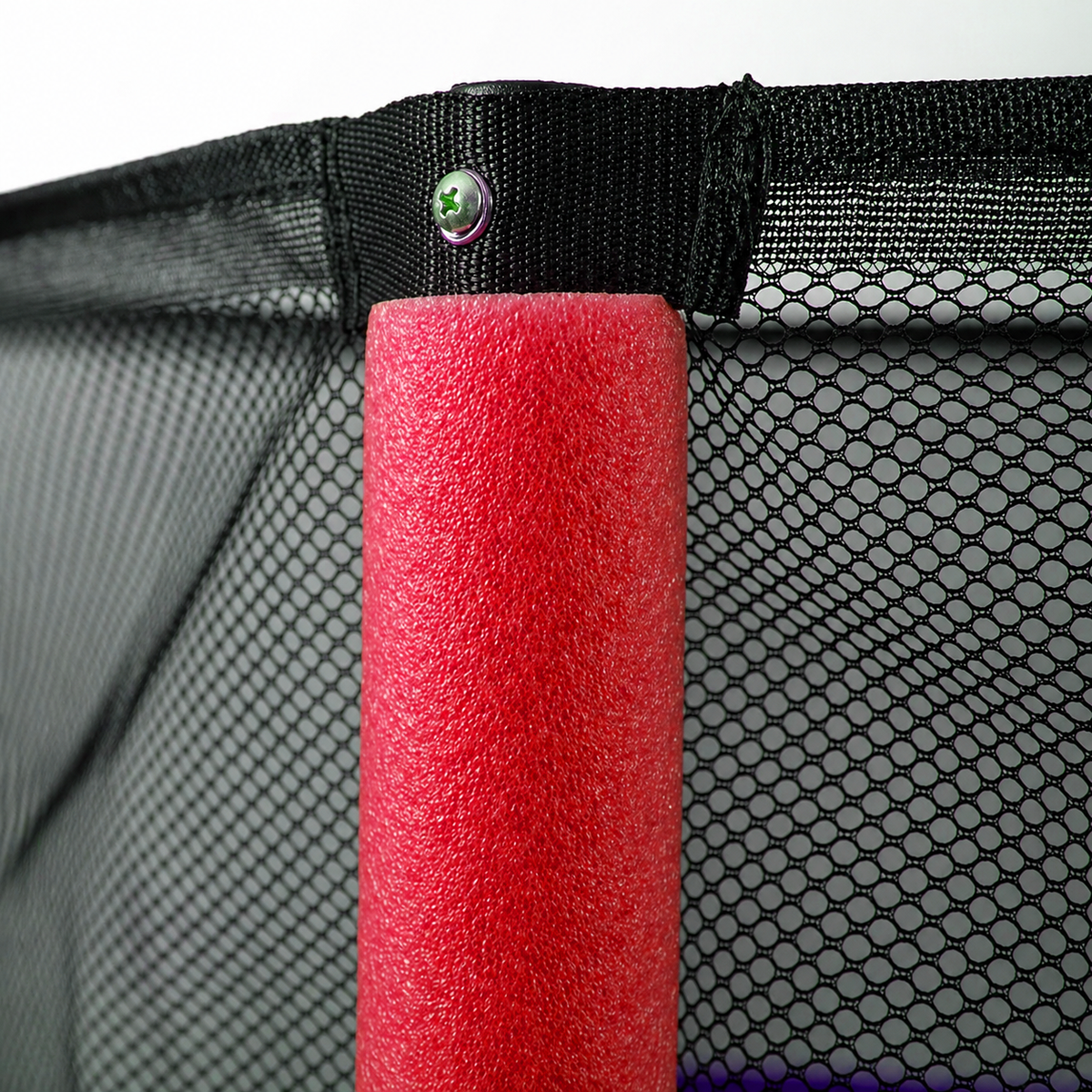 Kids' trampoline safety net enclosure securely attached to a heavy-duty steel pole with protective red foam padding.